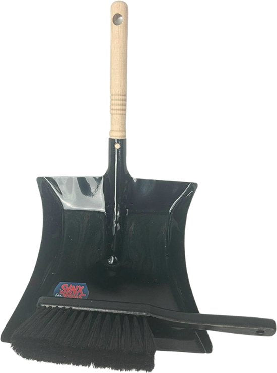 Zwarte metalen stoffer en blik met borstel